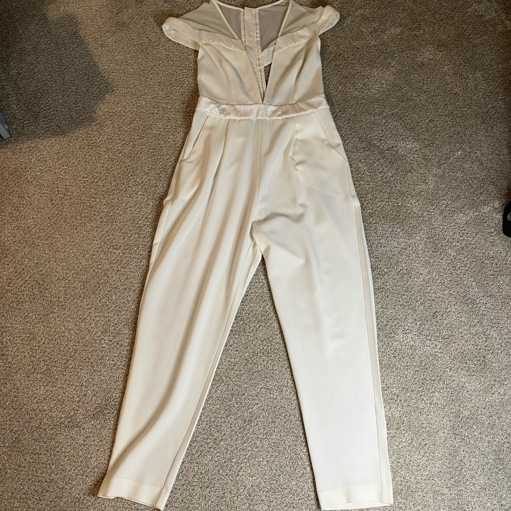 ASOS cream/white jumpsuit is size 6. Perfect for bachelorette party!